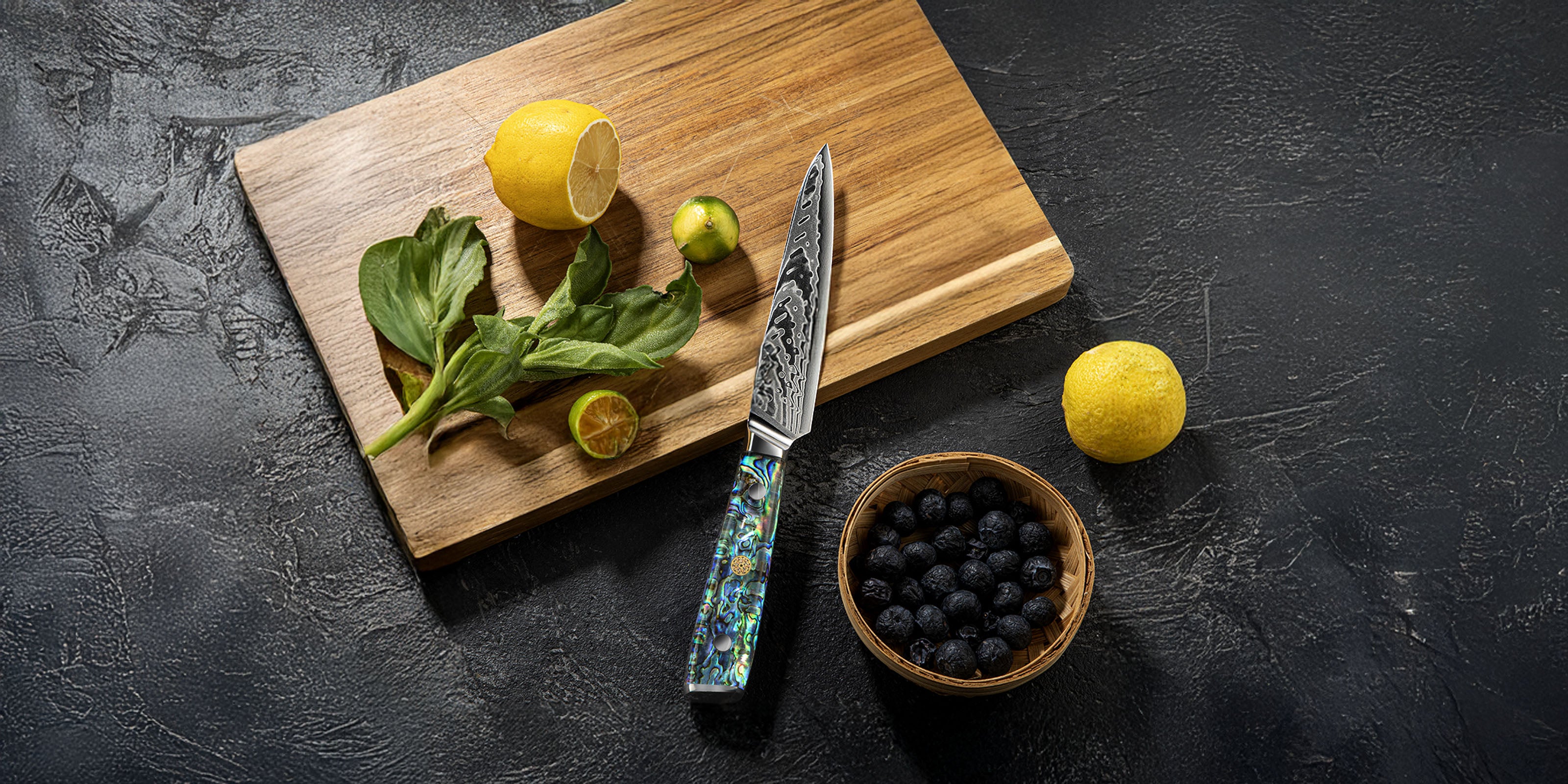 Damascus Utility Knife with Resin Handle on Wooden Cutting Board