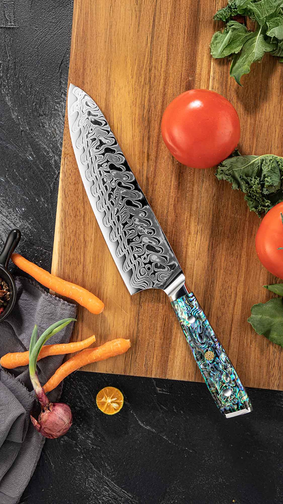 Damascus knife with a blue handle on a wooden cutting board with vegetables.